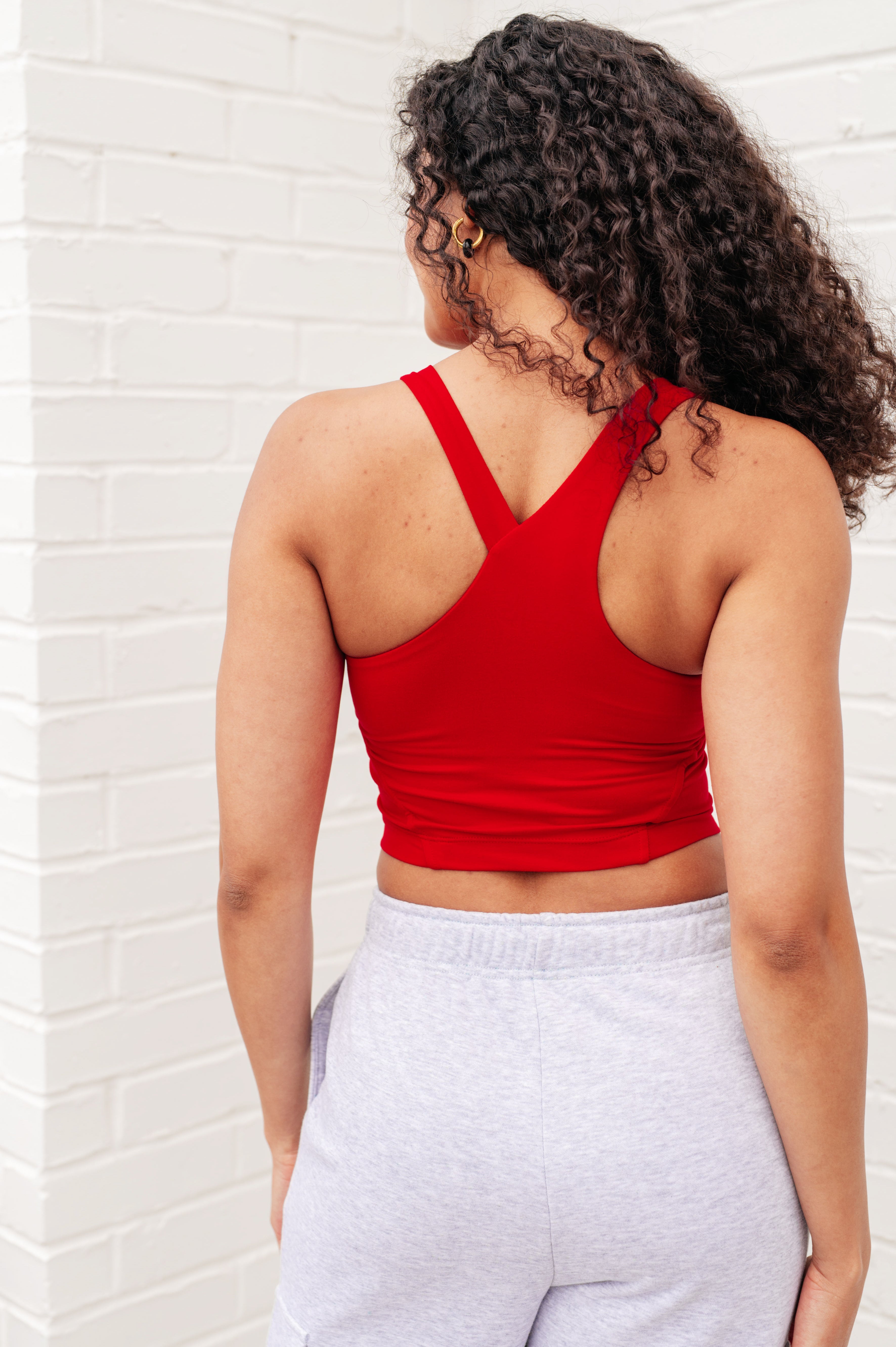 Doing it For Me Asymmetrical Tank in True Red Athleisure Ave Shops   